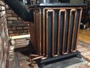 copper-piping-around-a-wood-burner-heating-water-to-radiators.jpg