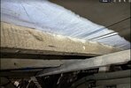close up of old beams against roof membrane.jpg