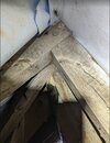 close up of old beams against roof membrane 2.jpg