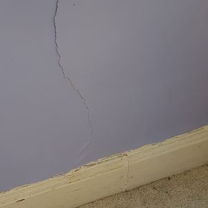 Hairline crack down to skirting boards