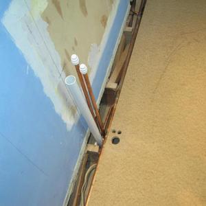 Fitting floor over pipes