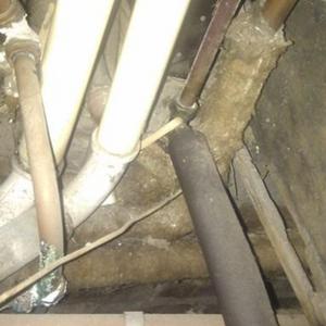pipes from water tank under floor