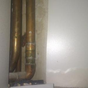 pipes in cupboard below boiler