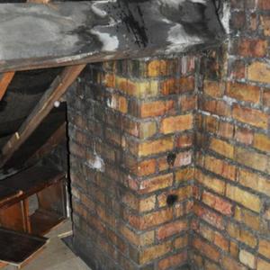 Damp on rear purlin at chimney stack