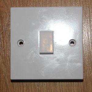 A light switch without earthed screw holes. (2)